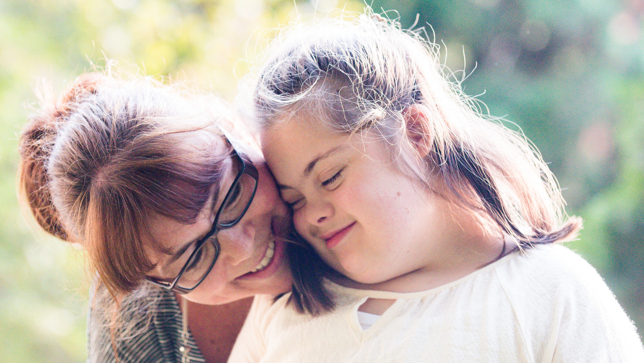 mother hugging her daughter with developmental disability