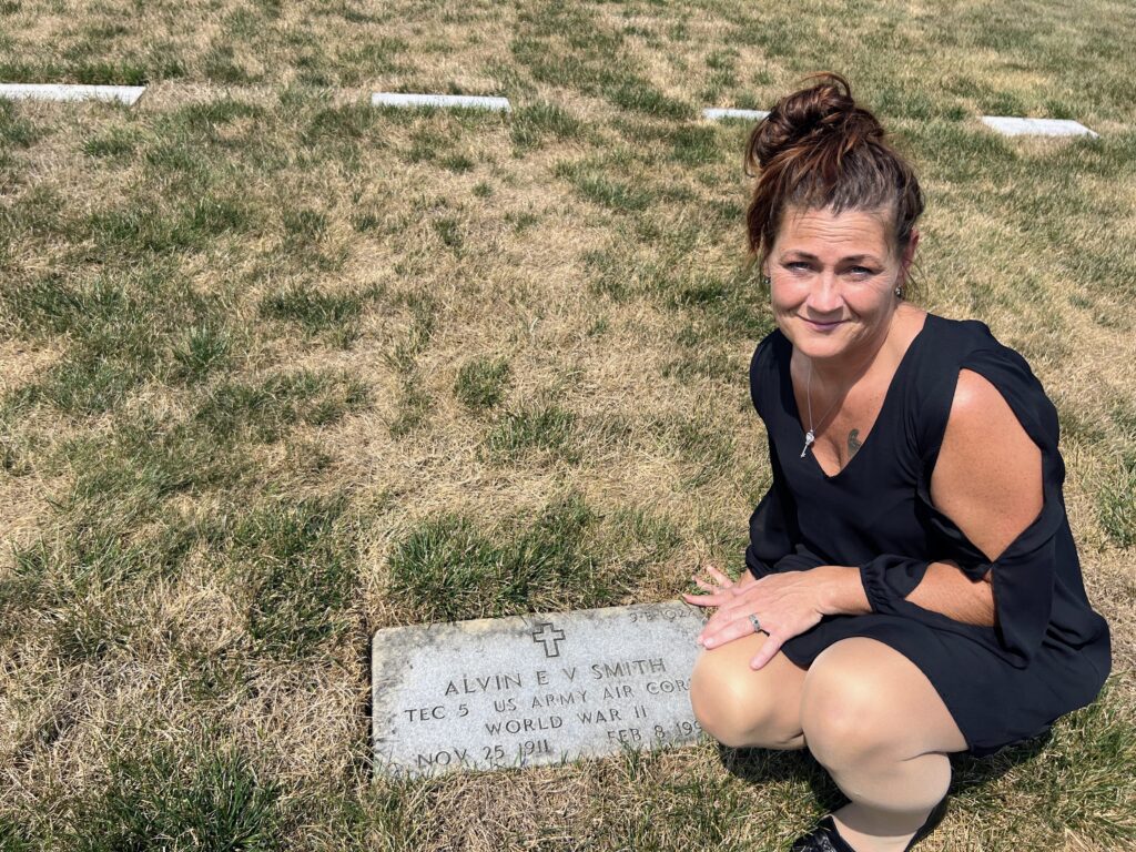 Tracy T. visits Alvin's grave