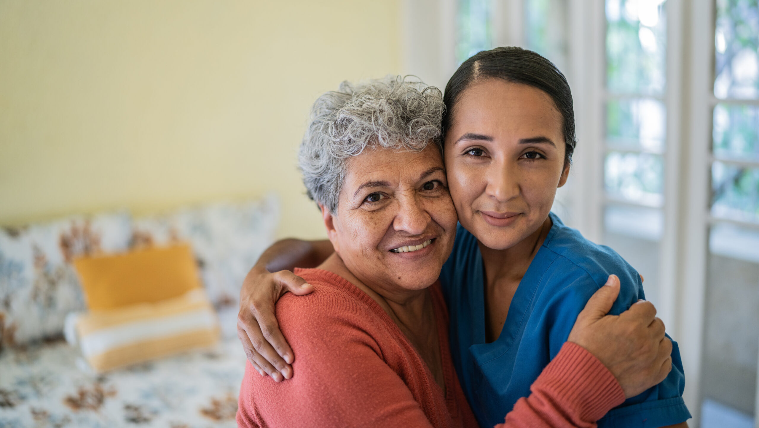 woman and older woman hugging