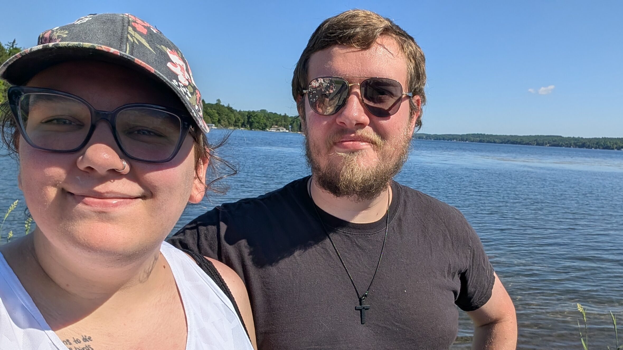 Female PPL employee at the lake with a man wearing sunglasses